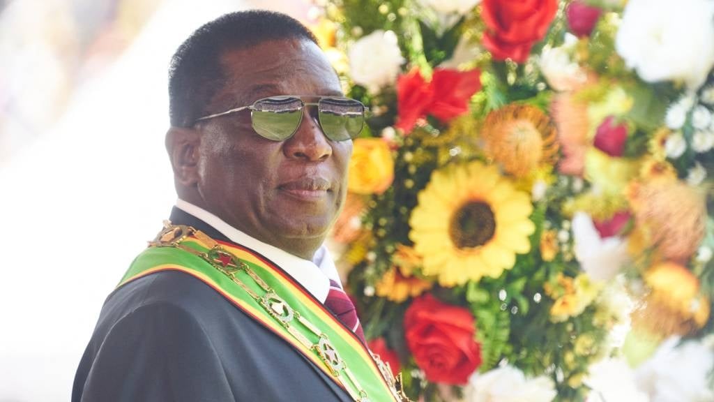 Zimbabwean President Emmerson Mnangagwa inspects t