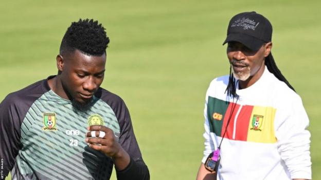 Cameroon's head coach Rigobert Song oversees a football training session of his players including goalkeeper Andre Onana
