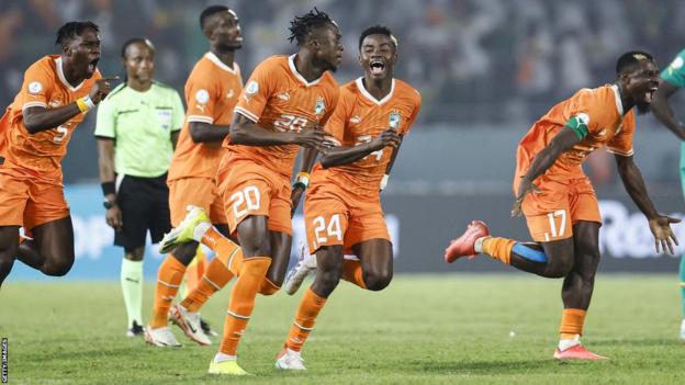 Ivory Coast celebrate during the Africa Cup of Nations (Afcon) 2023 round of 16 football match between Senegal and Ivory Coast at the Stade Charles Konan Banny in Yamoussoukro